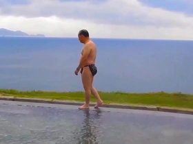 Elderly Asian man enjoys oral attention