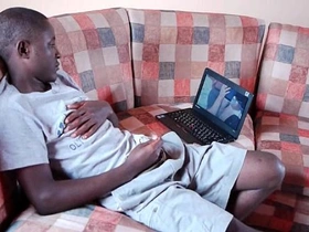 Young black men from Africa engage in mutual masturbation