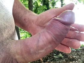 Witness the naked outdoor pleasure of a man's intense orgasm